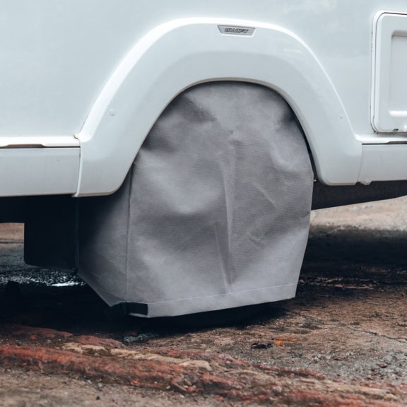 A picture of a grey Wheel Cover on a caravan wheel.