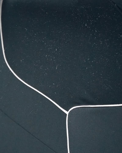 A picture showing dust settled on top of a Indoor Pro Car Cover.