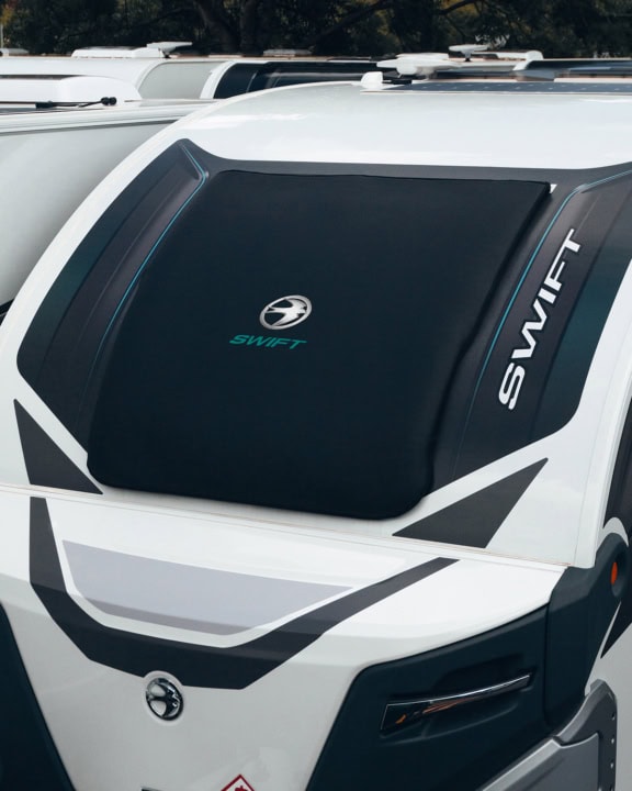 High-quality, weatherproof cover for the Swift Basecamp Elite camper van, designed for durability and UV resistance. Easy to fit and remove, providing optimal protection against rain, sun, and dust.