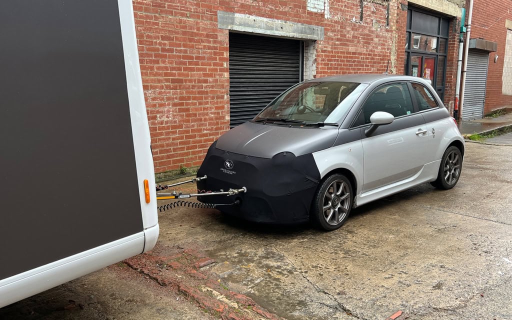 Durable towing car cover to shield your vehicle from elements and scratches.