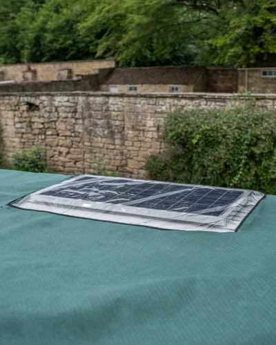 An image of a perspex solar panel window on the roof.