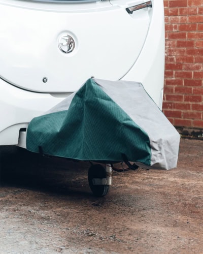 A picture of a grey and green a-frame cover to add to a Caravan Cover.