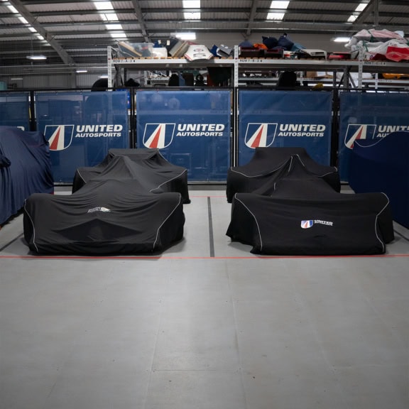 High-quality custom covers for race cars and motorsport vehicles, designed for protection and branding, available for professional racing teams and enthusiasts at Specialised Covers.
