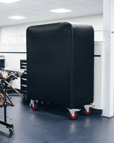 Durable black wheel cover designed for racing cars and motorsport vehicles, providing protection from dust, dirt, and environmental damage during storage and transportation.