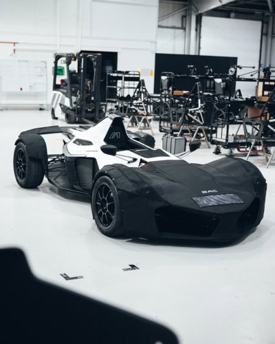High-quality custom cover for racing cars at motorsport events, protecting against dust, dirt, and scratches. Designed for durability and perfect fit in any racing environment.