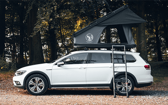 EXTREME weatherproof roof tent cover protecting a vehicle from rain, snow, and sun, ideal for camping enthusiasts seeking durable outdoor gear.
