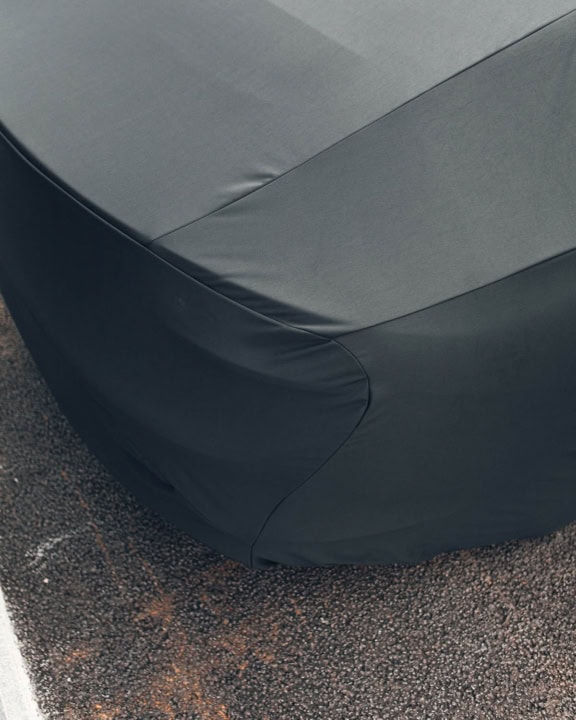 1. Custom fit waterproof car cover protecting vehicle from weather damage and dirt.