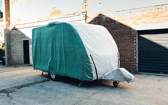 Protective caravan cover for outdoor storage, lightweight and durable, weather-resistant, custom-fit caravan covers by Specialised Covers in the UK.