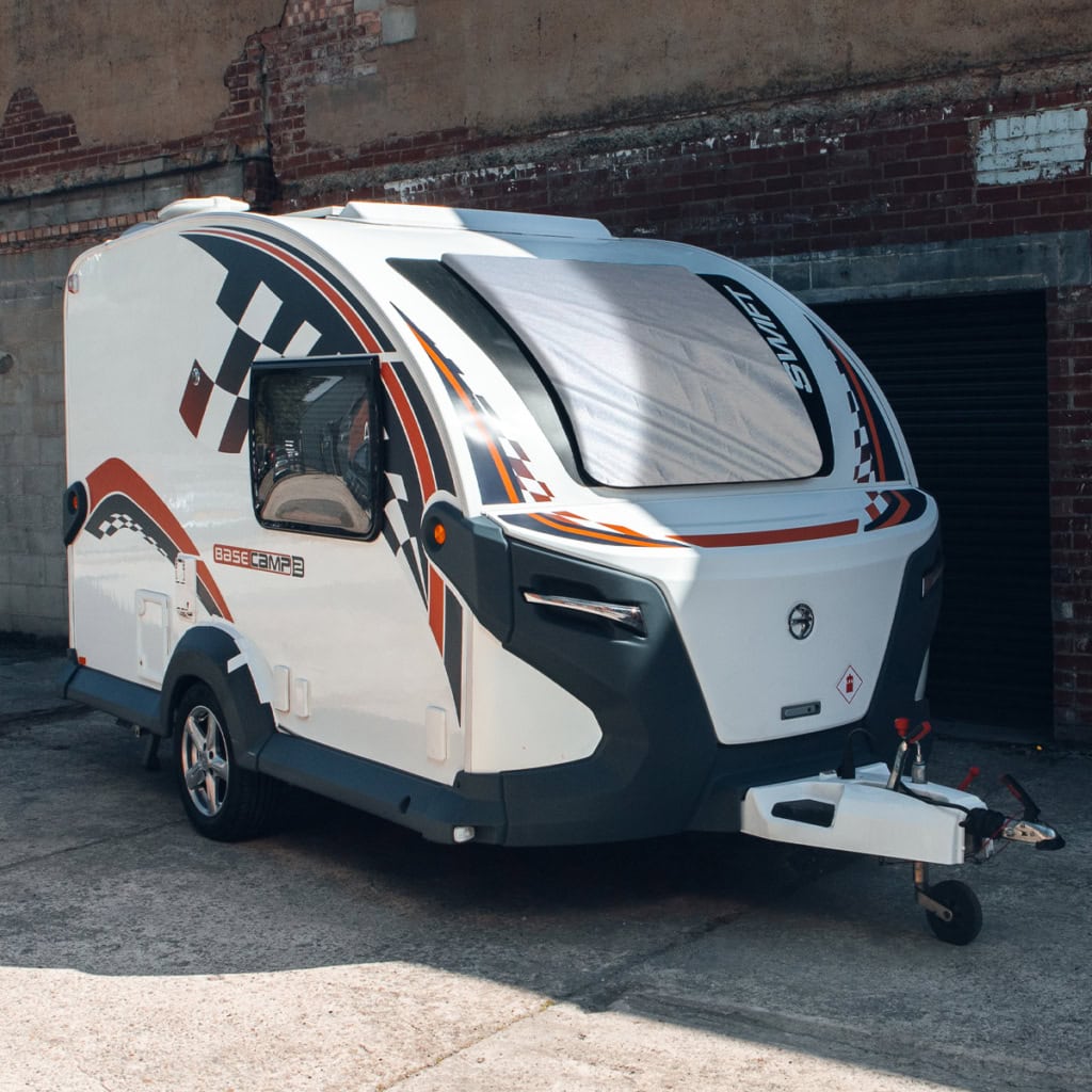 Modern caravan with specialised cover from Specialised Covers, designed for protection and durability during travel and storage.