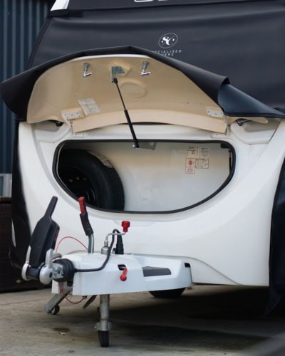 Heavy-duty sleek trailer hitch with secure wiring connections and protective cover, designed for towing ease and safety, compatible with Tow Pro+ braking systems.