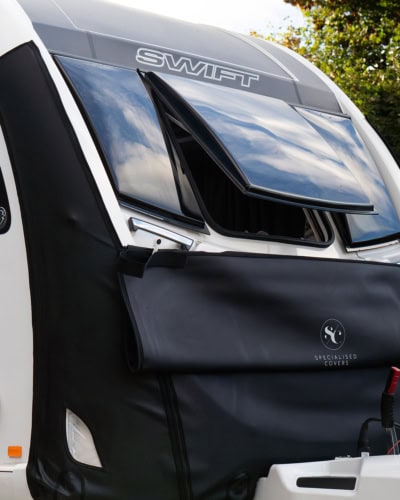 Durable caravan windscreen cover with vented design for Tow Pro+ and other RVs, providing protection against weather elements and UV rays for extended vehicle lifespan.