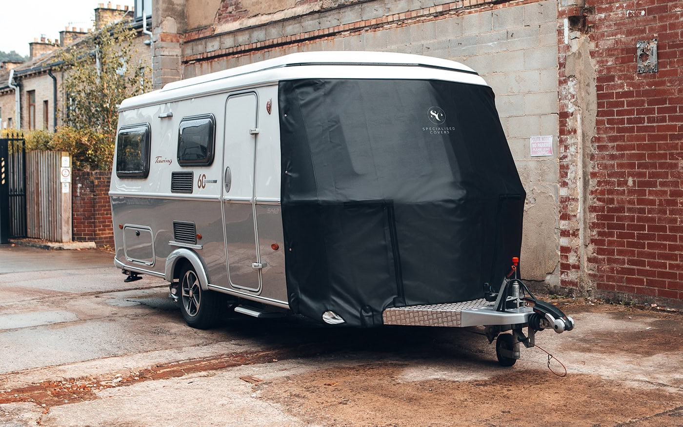 Robust caravan cover designed for Tow Pro trailers, shields against rain, dirt, and UV rays, ensuring long-lasting durability and maintenance of your camping vehicle.