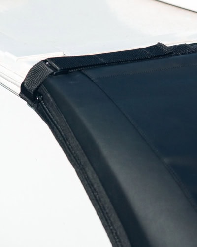 High-quality black trailer cover with secure straps for Tow Pro Infinity, protecting your trailer from weather and debris, ideal for vehicle security and maintenance.