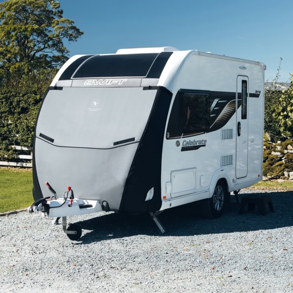 Durable caravan cover designed for Tow Pro Infinity models, offering premium protection against weather elements, UV rays, and scratches. Custom-fit and easy to install for optimal safety.