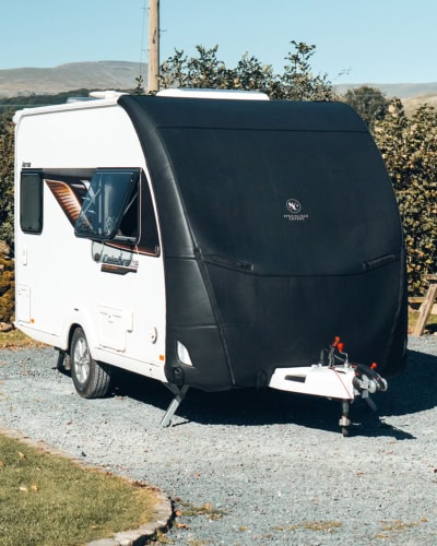 High-quality black trailer cover protecting Tow Pro Infinity Elite, weather-resistant and durable for ultimate vehicle protection.