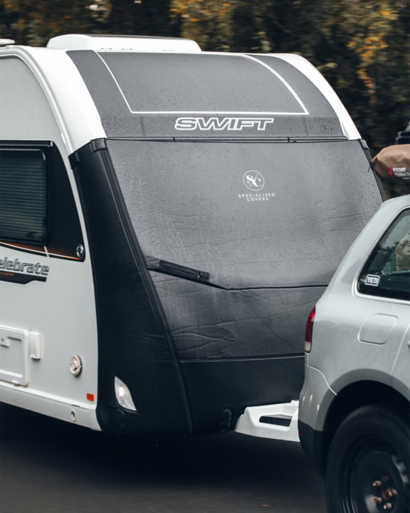 A caravan being towed with a Tow Pro Elite on the front.