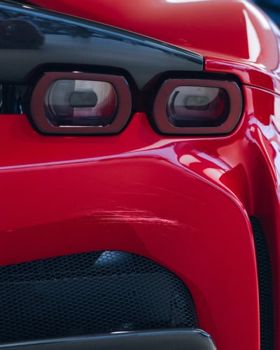 A picture of a scratch on the back of a Ferrari from being unprotected.