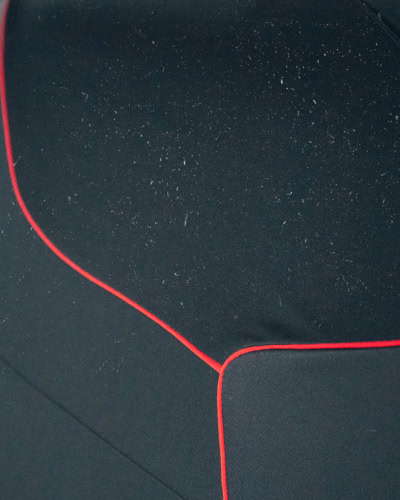 A picture of dust on a black Indoor Plus car cover.