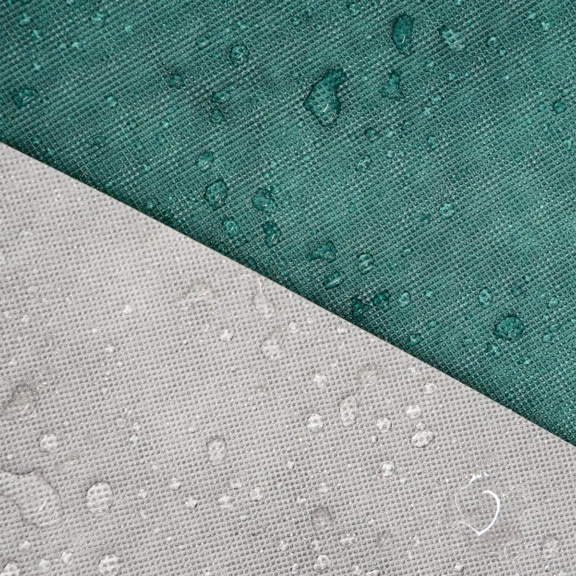 A close up image of the Specialised Covers Torrent material with water beads.