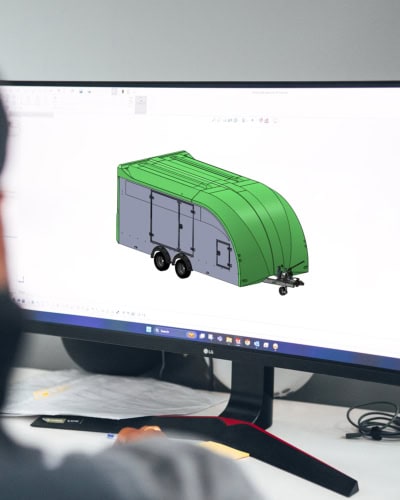 An image of a 3D Designer working on a Trailer Cover.