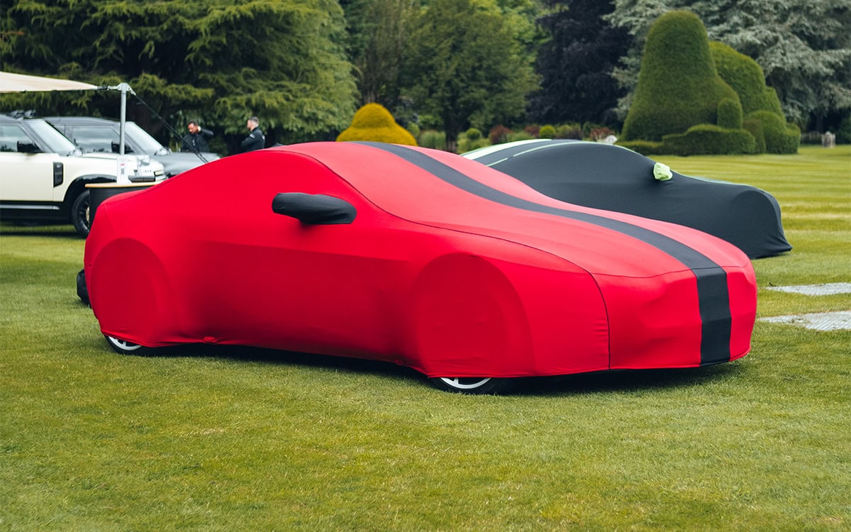 High-quality car cover suitable for indoor and outdoor use, offering protection from dust, dirt, and weather elements, ideal for car enthusiasts and collectors.
