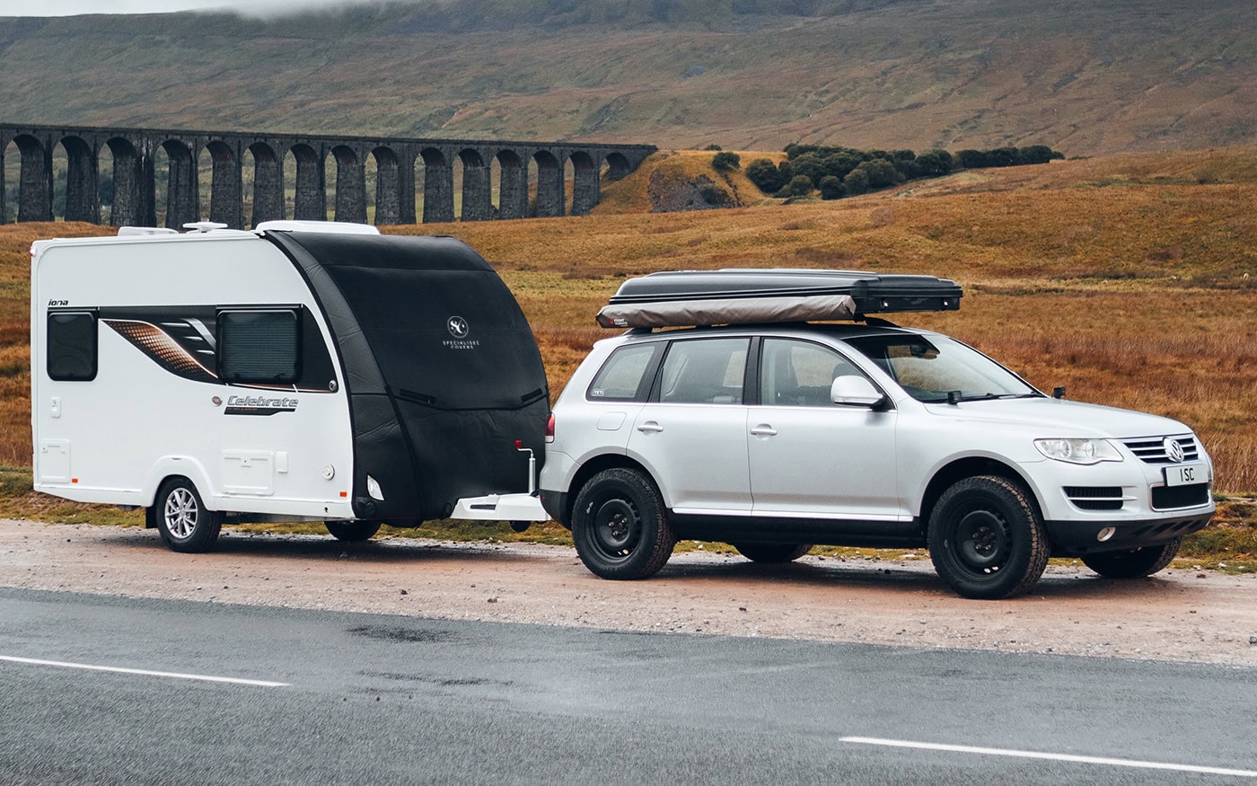 Durable towing cover for caravans and trailers, offering weather resistance and easy fitment for safe transport on all roads.