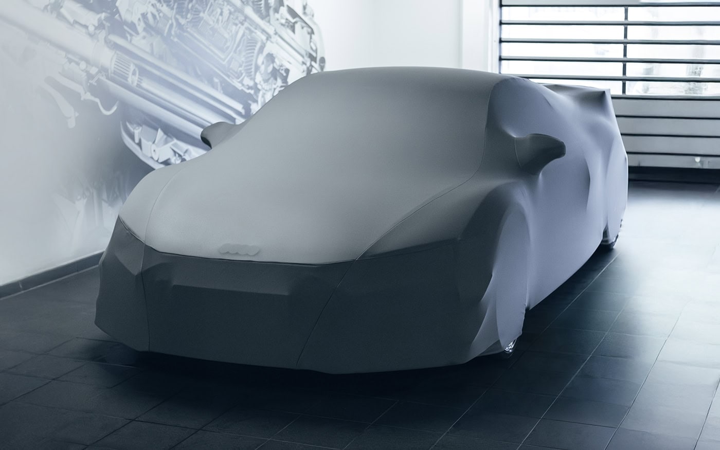 An Audi R8 with a bespoke fit car cover.