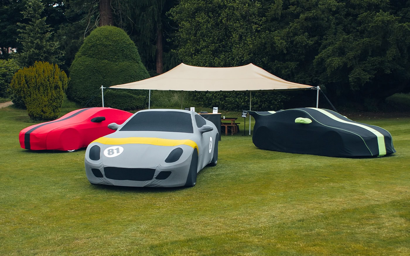 Durable, custom-fit car covers designed for race cars and classic cars to protect against weather, dust, and scratches, ensuring the vehicle stays in pristine condition - ideal for collectors and racers.