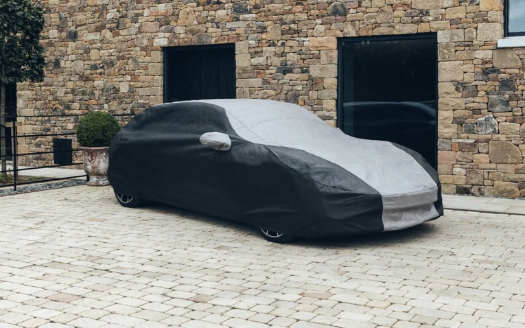 Protective car cover, weatherproof, tailored to fit your vehicle, perfect for outdoor storage and safeguarding your car's paintwork.
