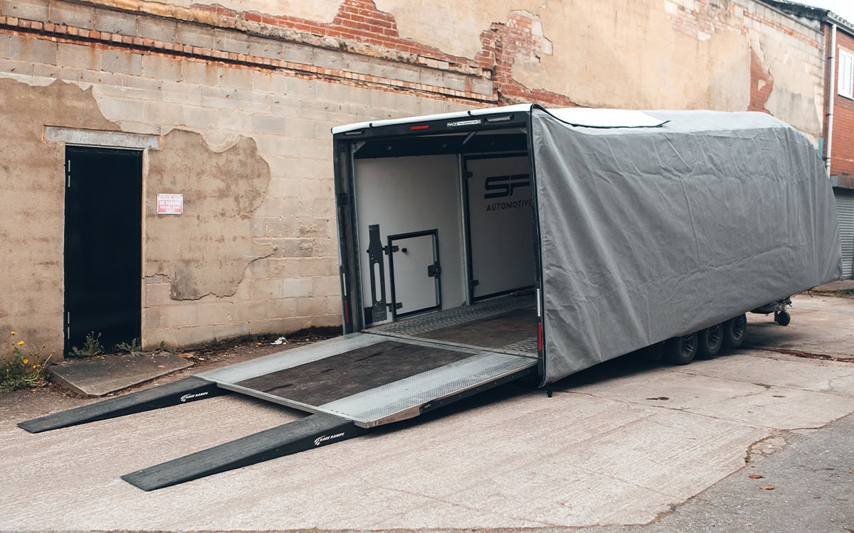 High-quality transporter trailer cover with ramp, weather-resistant material, easy to install, and designed for maximum protection of your vehicle during transit. Suitable for various trailer sizes and transport needs.