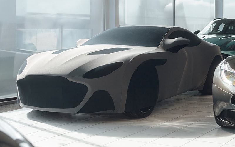 Premium car cover protecting luxury vehicles from dust, dirt, and scratches. Custom-fit for sleek sports cars to ensure ultimate protection and style.