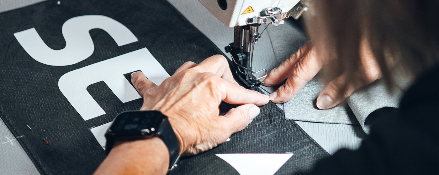 Sewing Machinist working on a satellite dome cover.