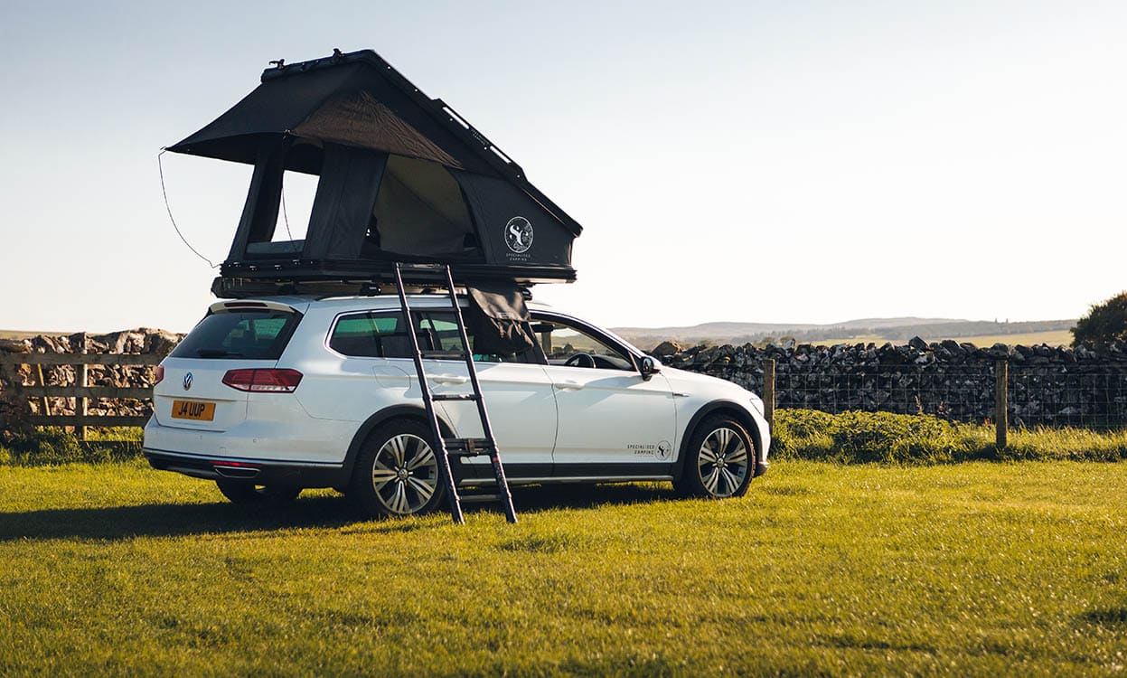 Versatile vehicle with mounted roof tent ideal for camping trips, outdoor adventures, and car-based camping. Suitable for all weather, easy to set up, and perfect for exploring nature in style and comfort.