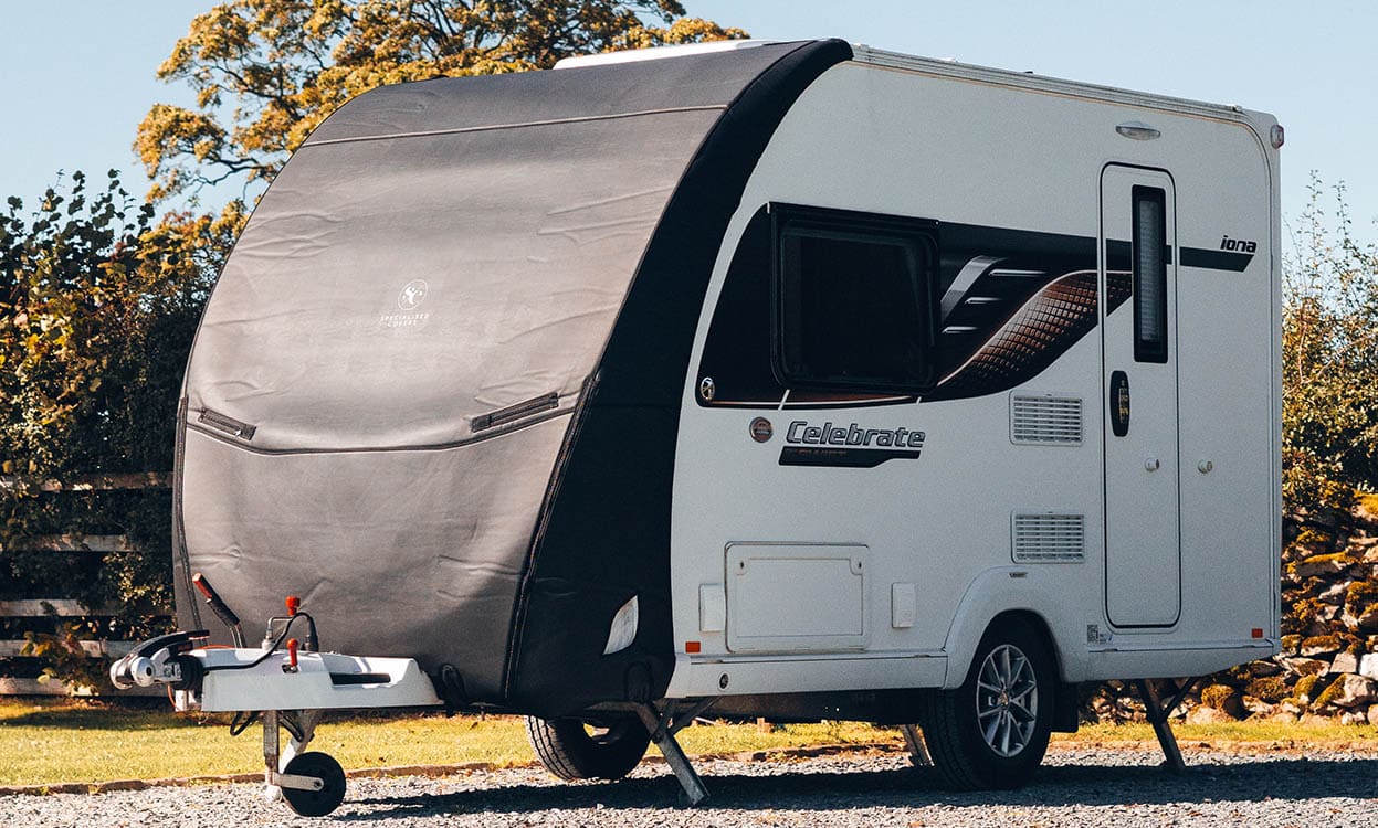 Caravan cover, outdoor protection, weather-resistant, UV protection, custom-fit, durable, caravan maintenance, outdoor lifestyle, camping accessories.