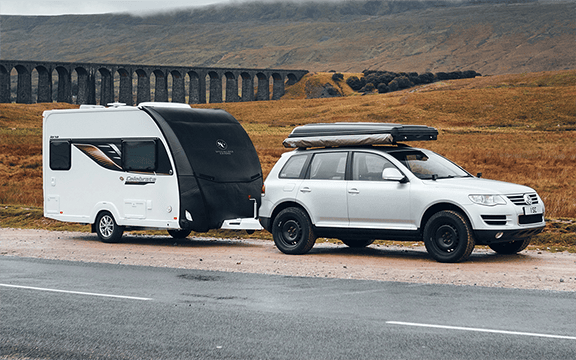 Caravan and vehicle towing cover from Specialised Covers, designed to shield against the elements and extend the lifespan of your equipment.