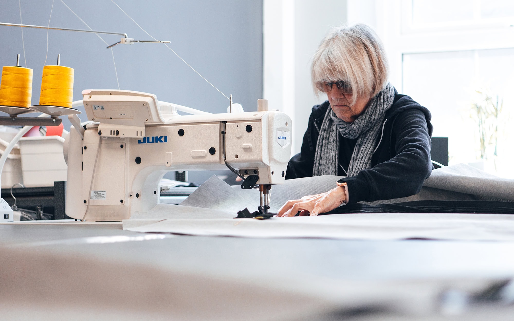 Soft furnishings and textiles expertly crafted with specialised covers for durable, customised protection in sewing and tailoring workshops.