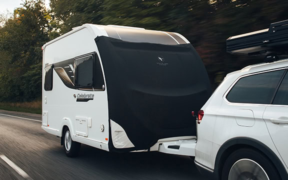 High-quality custom caravan cover protecting your caravan from weather damage, dust, and UV rays, ensuring longevity and cleanliness for outdoor travel and storage needs.