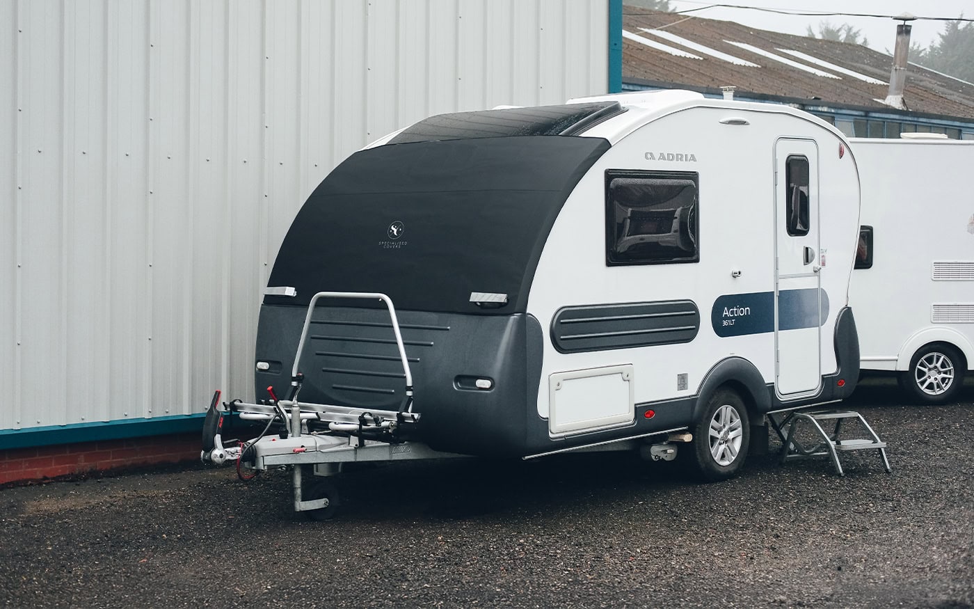 Custom-fit cover for Adria Action Elite caravan, providing protection against weather elements and UV damage. Perfect for outdoor storage and maintenance.