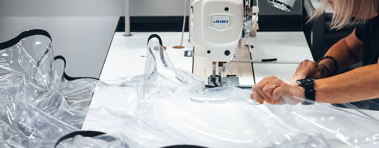 High-performance technical fabrics being sewn for defence and industrial applications, showcasing durability and precision in manufacturing.