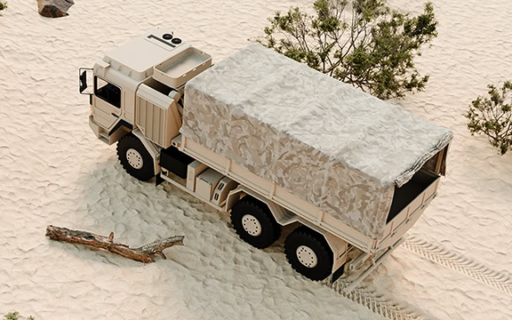 Heavy-duty vehicle cover designed for off-road trucks, providing protection against dust, dirt, and weather elements in sandy environments.