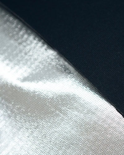 Close-up of specialised window cover fabric showing durable, reflective material for panoramic windows.