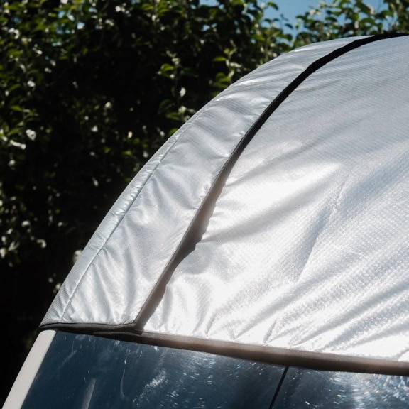 Close-up of a specialised cover for a panoramic window, made from durable, weather-resistant fabric, providing protection and privacy.