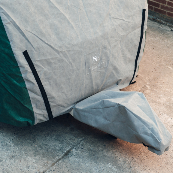 A close-up of a caravan storage cover protecting a caravan from weather elements, highlighting durability and quality.